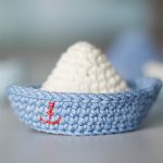 Jolly Roger Crochet Boat. Only One Boat In The Picture. White And Blue In Color With A Tiny Red Anchor On The Side || thecrochetspace.com