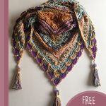 Lost In Time Crochet Shawl. Arranged with 3 tassels showing. Crafted in popcorn stitch || thecrochetspace.com