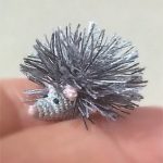 Micro Crochet Harry Hedgehog. Close up of the larger hedgehog crafted in silver grey || thecrochetspace.com