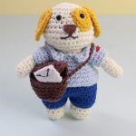 Mini Crochet Post Puppy. Puppy in postal uniform with postal bag on shoulder || thecrochetspace.com