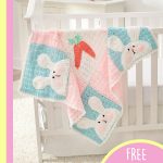 Perfect Luv Bunny Blanket. Blanket draped over a crib. Crafted in pink, blue and white || thecrochetspace.com