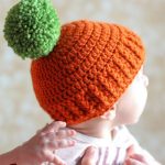 Pumpkin Parker Crocheted Hat. Orange bobble hat with green pom pom || thecrochetspace.com
