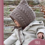 Textured Baby Crochet Hat. Toddler in brown hat and cream jacket || thecrochetspace.com