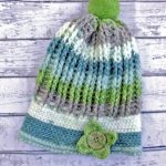 Uniquely Ribbed Crochet Hat. Crafted in green and grey shades with accent fun button || thecrochetspace.com