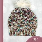 Woodland Slouchy Crochet Hat. Crafted in pinks/greens with faux fur pom pom || thecrochetspace.com